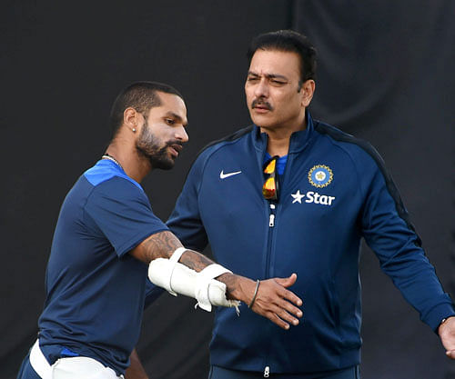 Team India's director of cricket Ravi Shastri with Shikhar Dhawan during a practice session in Dharamshala on Thursday ahead of the 4th ODI cricket match against West Indies. PTI Photo