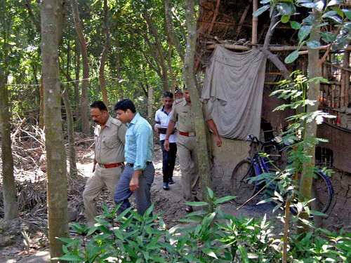 Officials of National Investigation Agency(NIA) searching the house of allegedly terrorist Kader Sk. (brother in law of Kausar, main accused in Burdwan IED blast, at Nimrah near Kirnahar in Birbhum district of West Bengal on Thursday, 16th, Oct, 2014. PTI Photo