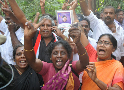 Supporters of former Tamil Nadu CM J Jayalalithaa celebrate as the Supreme Court granted her bail in the disproportionate assets case . DH photo