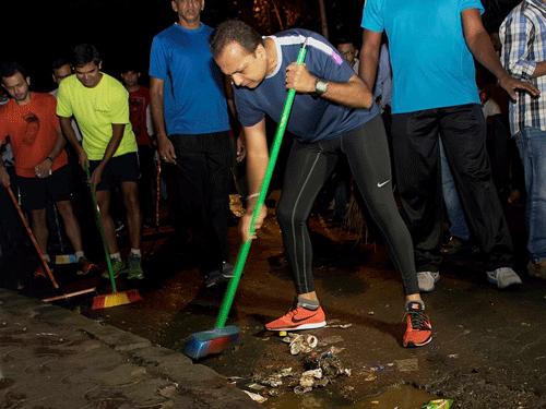 Taking forward Prime Minister Narendra Modi's initiative to rid the country of litter and rubbish, Reliance Group chairman Anil Ambani today cleaned the Badrinath and Kedarnath temple premises and area around it to spread the message of 'Swachh Bharat'. PTI File Photo For Representation