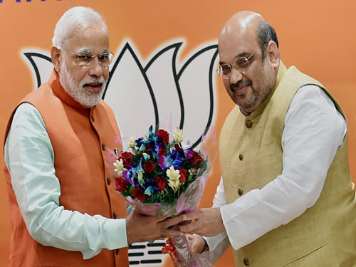 BJP president Amit Shah on Sunday said the results show that "Modi wave" was now a "tsunami" out to finish Congress as in both the states the oldest party was ousted out of power.   PTI