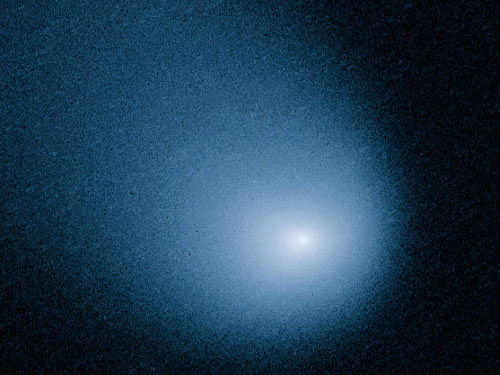 A comet the size of a small mountain whizzed past Mars today, wowing space enthusiasts with the once-in-a-million-years encounter. AP file photo