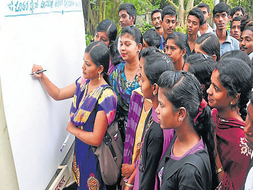 Students participate in the signature campaign in Mysore, on Monday. dh photo