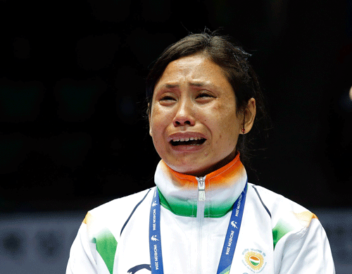 Taking a strict action, AIBA has provisionally suspended India's woman boxer Laishram Sarita Devi for refusing to accept the bronze medal at the Asian Games podium ceremony.PTI File Photo