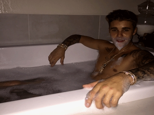 Singer Justin Bieber has shared a nude photograph of himself in a bath tub with just bubbles covering his modesty. Photo Posted on Justin's Official twitter Page