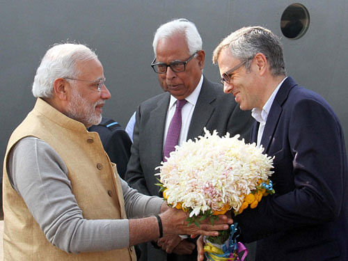 Narendra Modi appreciated Omar Abdullah for taking up the broom and cleaning a street in Srinagar. PTI Photo