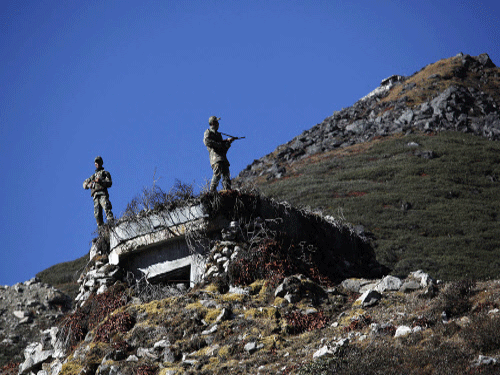 Indian army soldiers keep watch at the Indo China border in Bumla at an altitude of 15,700 feet above sea level in Arunachal Pradesh. Unfazed by China's objections to development of border areas, Government today announced setting up of 54 new border outposts and a Rs 175 crore package for beefing up the infrastructure along the border in Arunachal Pradesh. AP file photo