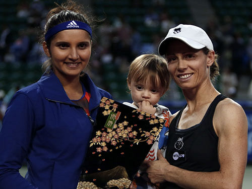 Indo-Zimbabwean women's doubles tennis combine Sania Mirza and Cara Black came back from three match points down to defeat Czech-Slovenian pair of Kveta Peschke and Katarina Srebotnik 4-6, 7-5, 11-9 to enter the summit clash of the WTA Finals here Saturday. Reuters file photo