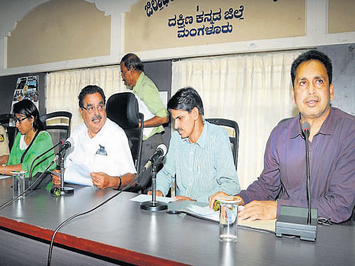 Minister for Forests and Environment B Ramanath Rai speaks at a review meeting, at DC's office in Mangalore  on Saturday. DH photo