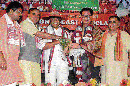 Union Minister of State for Home Affairs Kiren Rijiju and Railway Minister D V Sadananda Gowda being felicitated during the conclave of the BJP Karnataka North-East Samparka cell in Bangalore on Saturday. (From left) BJP leader R Ashoka, Union Minister Ananth Kumar and BJP's North-East Samparka cell convener Sunil Devadhar are with them. DH photo
