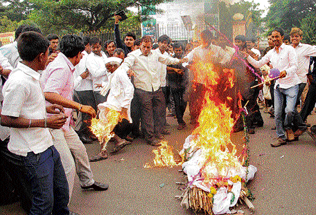 PROTEST GONE AWRY The dhoti of an elderly person caught fire while burning an effigy during a protest in Bidar on  Saturday. DH photo