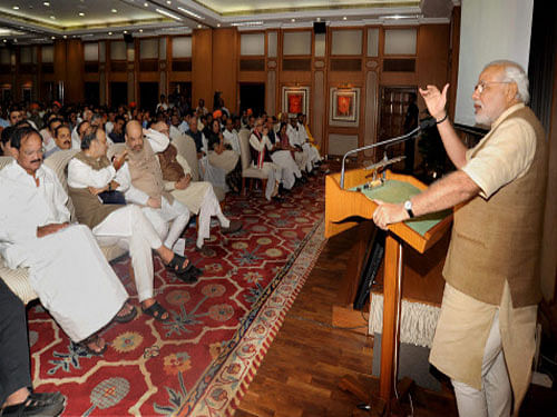 Prime Minister Narendra Modi on Sunday exhorted MPs from the ruling National Democratic Alliance (NDA) to think above politics and ensure implementation of government schemes such as the Clean India Mission in their constituencies. PTI photo