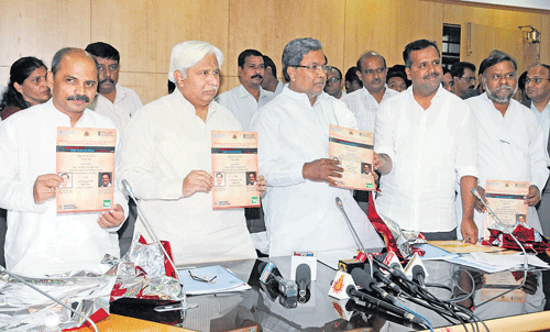 New findings: Chief Minister Siddaramaiah releases a survey report on tobacco-related diseases in Bangalore on Tuesday.  Medical Education Minister Dr Sharanaprakash Patil, Rural Development and Panchayat Raj Minister H K Patil, Health and Family Welfare Minister U T Khader and Social Welfare Minister H Anjaneya are also seen. dh Photo