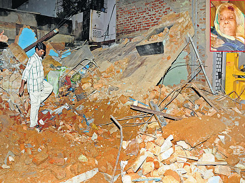 The two-storey house on Hennur Main Road, Lingarajapuram, that collapsed following heavy rainfall on Tuesday, burying Jo Mary (inset) alive. DH photo