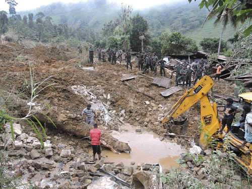 At least 14 people were killed and around 300 others are missing in a landslide in central Sri Lanka Wednesday as President Mahinda Rajapaksa directed the government to fully support rescue efforts. Reuters photo