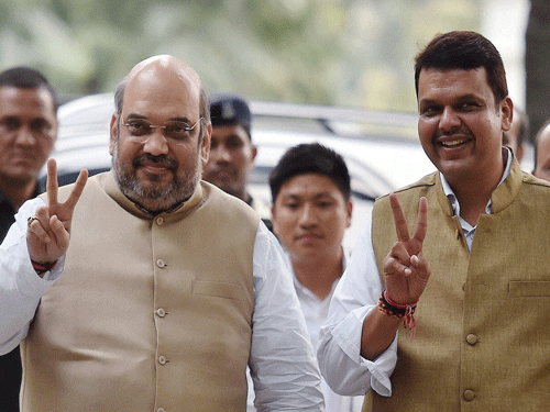 BJP President Amit Shah with Maharashtra Chief Minister- designate Devendra Fadnavis after a meeting in New Delhi on Thursday. PTI Photo