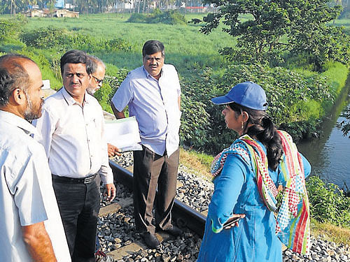 Deputy Commissioner C Shikha inspects storm water drains in various parts of the city being developed under Jawaharlal Nehru Urban Renewal Mission (JnNURM) works, on Thursday. Mysore City Corporation Commissioner C G Betsurmath and others are seen. DH photo