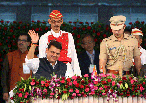 Devendra Fadnavis waves to the crowd after being sworn in as chief minister of Maharashtra. AP photo