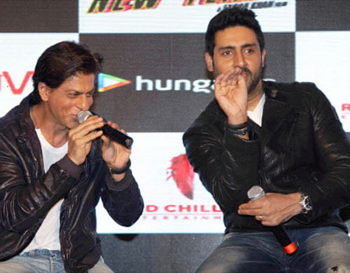 Bollywood actors Shah Rukh Khan and Abhishek Bachchan during an event in Mumbai. PTI photo