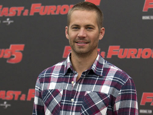 Paul Walker's fans will get to see the late star doing some dare devil stunts in 'Furious 7', the seventh film in the 'Fast & Furious' series. AP file photo