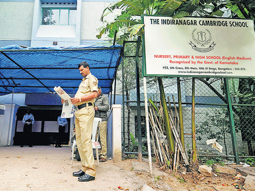 Police stand guard at The Indiranagar Cambridge school.
