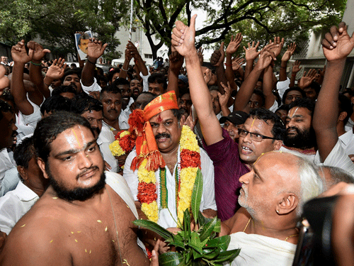 Former Union Minister G K Vasan along with his supporters after he formally announced his decision to revive the erstwhile Tamil Manila Congress (TMC) in Chennai on Monday. The Congress party split in Tamil Nadu on Monday as Vasan demerged Tamil Manila Congress (TMC) floated by his father GK Moopanar. PTI Photo
