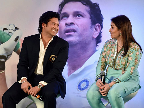 Cricket legend Sachin Tendulkar with wife Anjali during the release of his autobiography 'Playing ItMyWay' inMumbaionWednesday. PTI