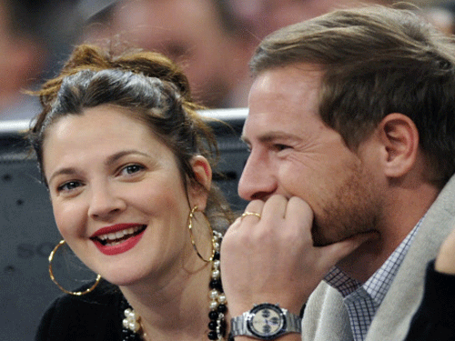Actress Drew Barrymore says her husband Will Kopelman makes it impossible for her to lose baby weight, as the duo are foodies. AP photo