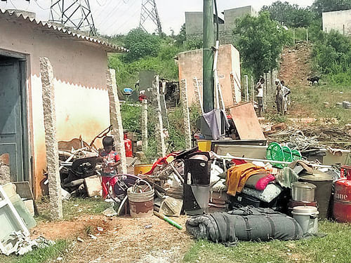 Belongings of the slumdwellerswhomthe Bangalore Urban district authorities threw out of their huts. DH PHOTO