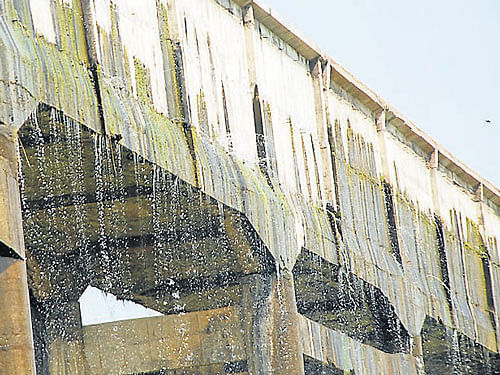 Water is seen leaking from the aqueduct of Varuna canal, near Bangalore-Mysore Highway, on the outskirts of Mysore.