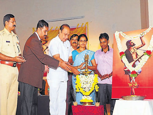 Urban Development Minister Vinay Kumar Sorake lights a lamp to inaugurate Kanaka Jayanthi celebrations in Udupi on Saturday. DH photo