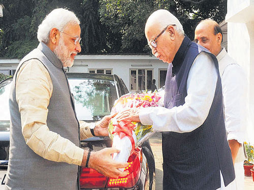 Protege turned patroniser: Prime Minister Narendra Modi greets BJP veteran leader Lal Krishana Advani on his birthday in New Delhi on Saturday. PTI
