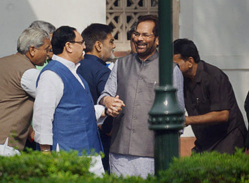 Bharatiya Janata Party leaders Mukhtar Abbas Naqvi (C), Ram Gopal Yadav and JP Nadda after a breakfast meeting with Prime Minister Narendra Modi at his residence before their induction into the Cabinet, in New Delhi on Sunday. PTI Photo