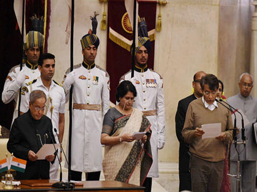 President Pranab Mukherjee administers oath to new Cabinet minister Suresh Prabhu at the swearing-in ceremony at Rashtrapati Bhavan. Suresh Prabhu today formally joined the BJP before being sworn in as Cabinet Minister in the first expansion of the Narendra Modi government. PTI photo