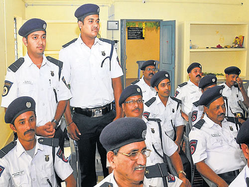 new role: Students Jeshwanthdhar and Mohammed Yunus (standing), who were inducted as honorary traffic wardens, at the office of ACP (K&#8200;R&#8200;Sub-division), in Mysuru, on Sunday.  dh photo