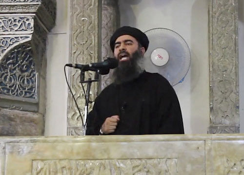FILE - This file image made from video posted on a militant website Saturday, July 5, 2014, which has been authenticated based on its contents and other AP reporting, purports to show the leader of the Islamic State group, Abu Bakr al-Baghdadi, delivering a sermon at a mosque in Iraq. On Sunday, Nov. 9, 2014, Iraqi officials and state television said al-Baghdadi has been wounded in an airstrike in western Iraq. An Interior Ministry intelligence official told The Associated Press on Sunday that the strike happened early Saturday in the town of Qaim in Iraq's Anbar province.AP