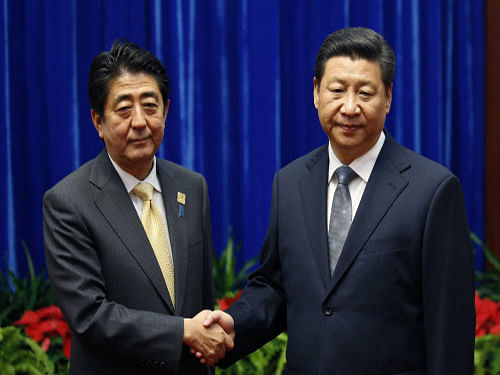 In a diplomatic breakthrough, Chinese President Xi Jinping and Japanese Premier Shinzo Abe today held their maiden talks, marking the 'first step' towards mending ties between the two Asian rivals after years of territorial disputes and animosity due to wartime history.