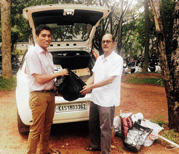 CIVIC SENSE Achitra Borgohain takes a bin bag from a grateful Bangalorean.