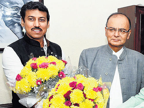 Arun Jaitley and Rajyavardhan Singh Rathore after taking charge as Union I&B Minister and Minister of State respectively in New Delhi on Monday. PTI