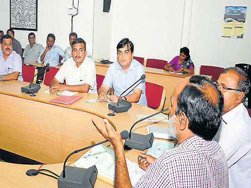 Senior Deputy Director of Food and Civil Supplies Department K&#8200;Rameshwarappa addresses a meeting of representatives of oil companies and distributors, at the Deputy Commissioner's office in Mysuru, on Tuesday. dh photo