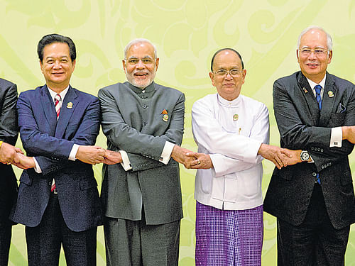 COMING TOGETHER: (Above) Singapore Prime Minister Lee Hsien Loong, Thailand Prime Minister Prayuth Chan-Ocha, Vietnam Prime Minister Nguyen Tan Dung, Prime Minister Narendra Modi, Myanmar President Thein Sein, Malaysia Prime Minister Najib Razak, Sultan of Brunei Hassanal Bolkiah and Cambodian Prime Minister Hun Sen at the 12th Asean-India summit at Myanmar International Convention Center in Nay Pyi Taw on Wednesday. AP