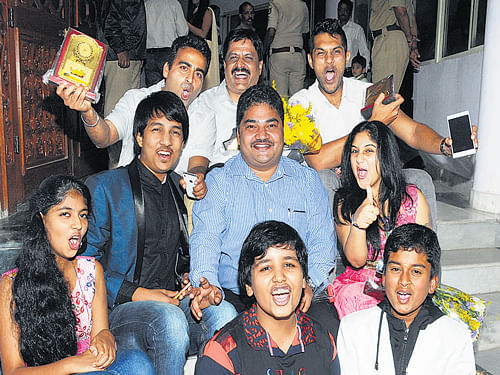 People who have made it big as child artistes-Master Anand, Vinayak Joshi, Master Kishen and Master Manjunath-pose with award winners during the inauguration of children's film festival in the City on Thursday. DH photo