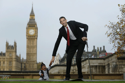 The world's shortest man Chandra Bahadur Dangi greets the tallest living man Sultan Kosen to mark the Guinness World Records Day in London November 13, 2014. Kosen measuring 251cm, towers over Dangi who is only 54.6cm tall. The Guinness World Records celebrates its 60th edition of the annual records book. REUTERS Photo