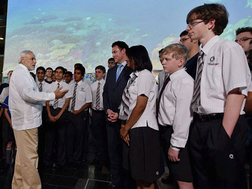 Prime Minister Narendra Modi interacts with students during a visit to Queensland University of Technology in Brisbane, Australia. An improper Indian map with parts of Jammu and Kashmir missing, put up during Prime Minister Narendra Modi's visit to the Queensland University of Technology (QUT) here Friday, was drawn attention to by Indian officials accompanying the prime minister. PTI photo