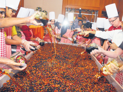 The cake-mixing ceremony in progress.  DH Photo by Bk Janardhan