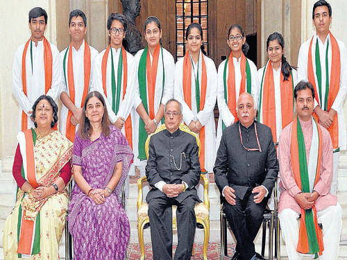 President Pranab Mukherjee and Minister for Women & Child Development Maneka Gandhi during the presentation of  National Awards for exceptional child achievers at  Rashtrapati Bhavan in New Delhi on Friday. PTI Photo