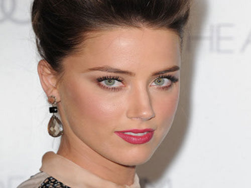 Hollywood star Johny Depp has reportedly bought a 300,000 pounds Ferrari for actress fiancee Amber Heard. AP photo