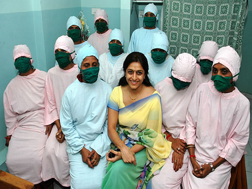 Dr. Nayana H. Patel, center, sits with surrogate mothers look on during an interaction with the media at the Kaival Hospital at Anand, in the western Indian state of Gujarat. AP file photo