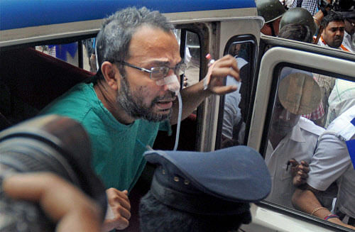 Suspended TMC MP and prime accused in Saradha chit-fund scam Kunal Ghosh being taken out of the hospital after having neurological tests done following his suicide attempt in Kolkata on Saturday. PTI