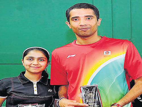 Savita RN and Arvind Bhat with their trophies after winning the Bangalore City Institute 5-star State ranking tournament in Bengaluru on Sunday. DH photo